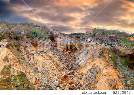 Erosion gully on an industrial waste landfill near Erosion gully on an industrial waste landfill near 62330942