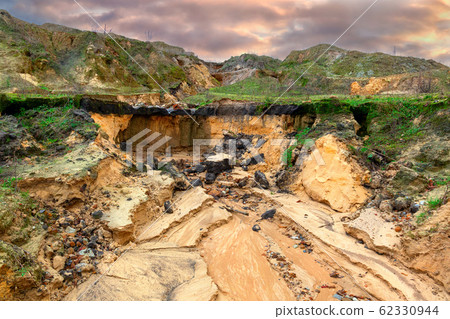 Erosion gully on an industrial waste landfill near Erosion gully on an industrial waste landfill near 62330944