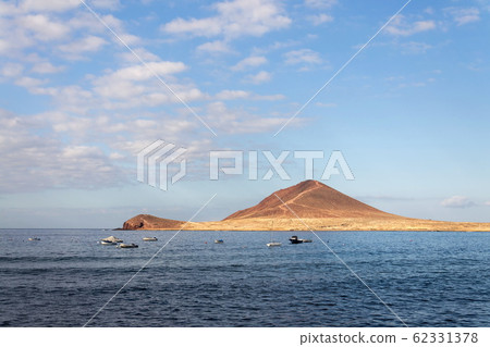 Montana Roja mountain on Tenerife coast near El Medano, Canary Islands, Spain, sunny summer day 62331378