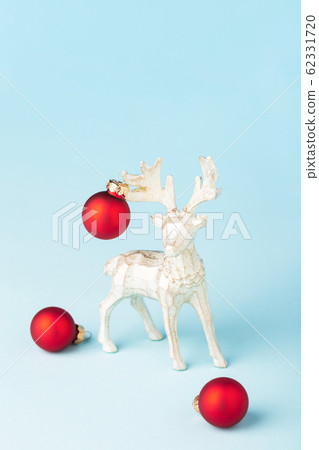 Christmas reindeer decorated like a New Year tree. 62331720