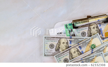 IRS 1040 tax return form with currency US dollar 62332308