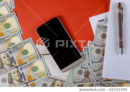 Tax retrun check with USA currency and spiral Tax retrun check with USA currency and spiral 62332309