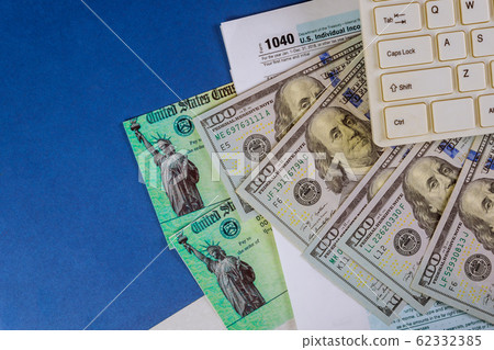 IRS 1040 tax return form with currency US dollar IRS 1040 tax return form with currency US dollar 62332385