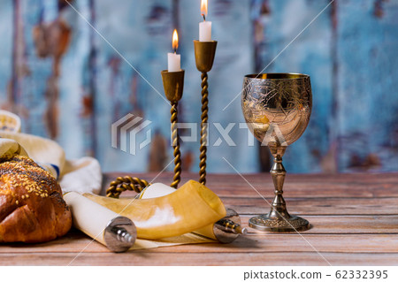 Shabbat eve table challah bread and candelas with Shabbat eve table challah bread and candelas with 62332395