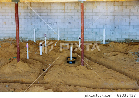 PEX and drain sewer pipes in home basement in the 62332438