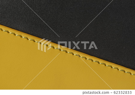 Texture of black and yellow genuine leather close-up sewn with stitch. Fashionable modern background, copy space Texture of black and yellow genuine leather close-up sewn with stitch. Fashionable modern background, copy space 62332833