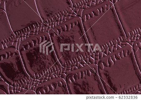 Texture of genuine leather close-up, embossed under the skin of reptile, burgundy color. For modern background Texture of genuine leather close-up, embossed under the skin of reptile, burgundy color. For modern background 62332836