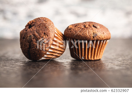 Tasty chocolate muffins. Sweet cupcakes. Tasty chocolate muffins. Sweet cupcakes. 62332907