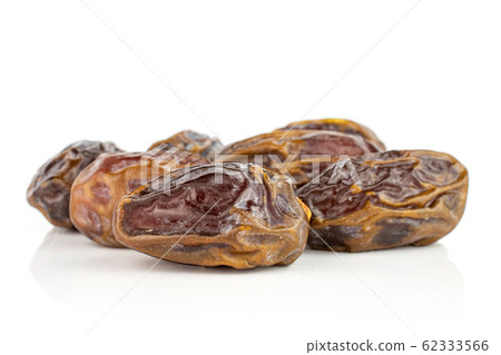Dry brown date fruit isolated on white Dry brown date fruit isolated on white 62333566