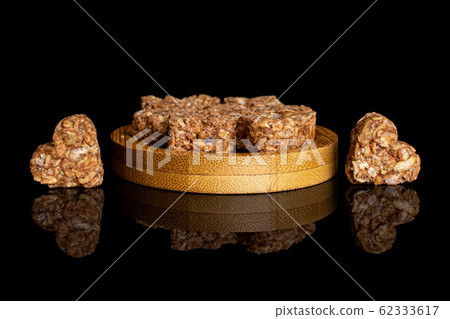 Cereal cocoa heart isolated on black glass Cereal cocoa heart isolated on black glass 62333617