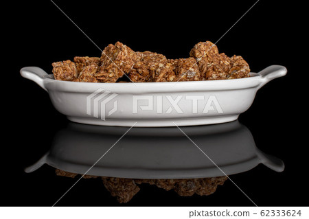 Cereal cocoa heart isolated on black glass Cereal cocoa heart isolated on black glass 62333624