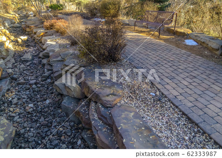 Brick pathway and rocky ground on a park in Provo 62333987