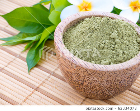 Henna powder and tiare flowers 62334078