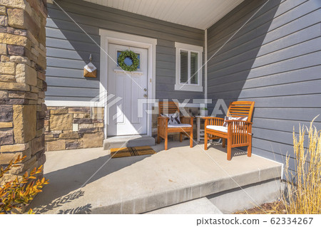 Facacde of a home with furniture on the welcoming 62334267