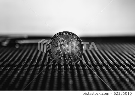 Bitcoin trading. Cryptocurrency coin on dark background.  62335010