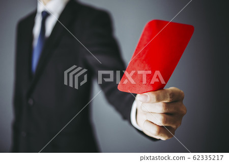 A businessman with a red card A businessman with a red card 62335217