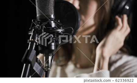 Woman recording vocals Woman recording vocals 62336922