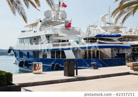 Pier with ships on a sunny day. Montenegro, summer, Tivat city Pier with ships on a sunny day. Montenegro, summer, Tivat city 62337251