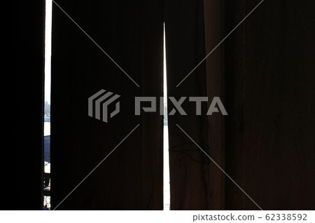 Old wooden wall with light rays background Old wooden wall with light rays background 62338592