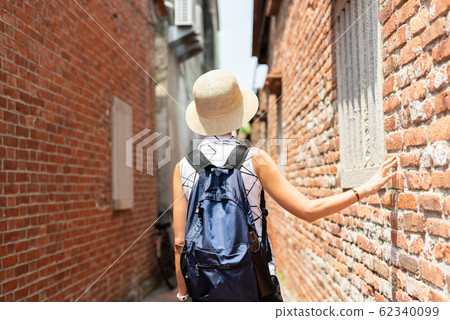 woman walking in the old street at Lukang town woman walking in the old street at Lukang town 62340099
