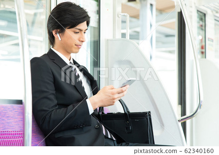 Commuter male train businessman shooting cooperation: Keio Electric Railway Co., Ltd. Commuter male train businessman shooting cooperation: Keio Electric Railway Co., Ltd. 62340160