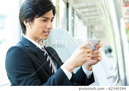 Commuter male train businessman shooting cooperation: Keio Electric Railway Co., Ltd. 62340164