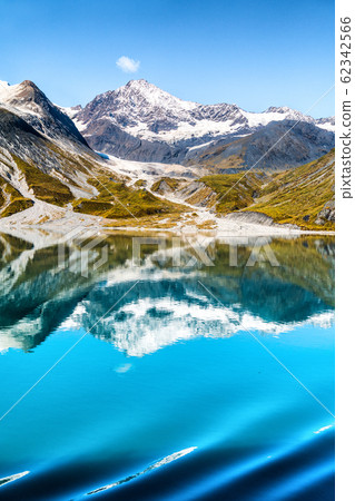 Glacier Bay National Park, Alaska, USA. Amazing glacial landscape view from cruise ship vacation travel showing mountain peaks and glaciers on clear blue sky summer day 62342566