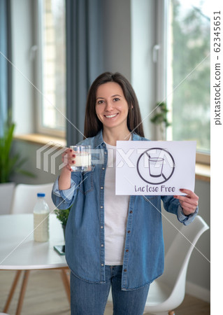 Woman going for lactose free milk products 62345651
