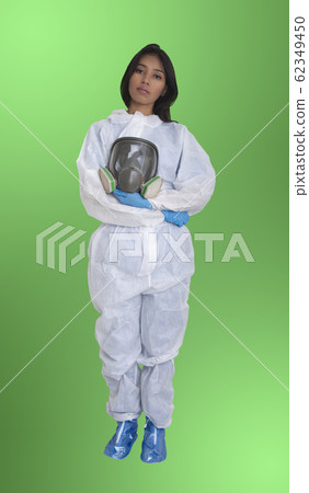 Female officer wearing protective suit on green Female officer wearing protective suit on green 62349450