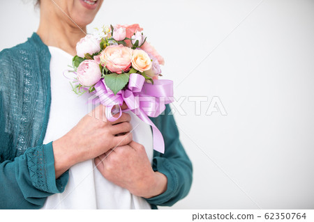 Mature woman and bouquet Mature woman and bouquet 62350764
