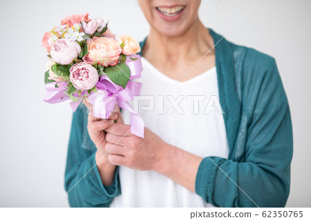 Mature woman and bouquet Mature woman and bouquet 62350765