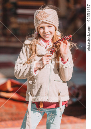 Cute kid have fun in old street of the city 62351487