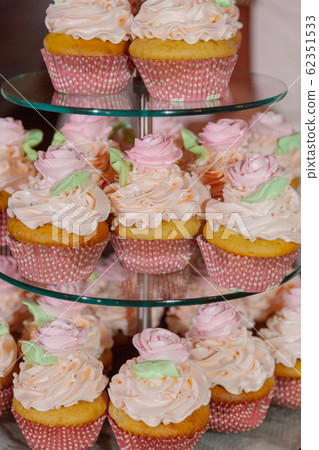 Beautiful fresh cakes on the festive table. 62351533