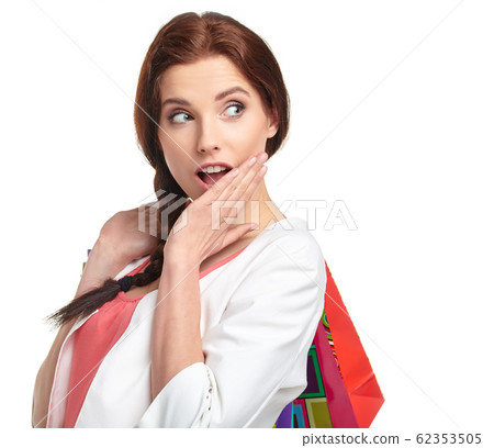 Shopping woman holding bags, isolated on white 62353505