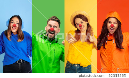 Portrait of young people celebrating red nose day on colorful background Portrait of young people celebrating red nose day on colorful background 62355265