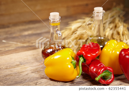 sweet peppers, wooden table background sweet peppers, wooden table background 62355441