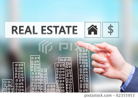 Businessman pointing on REAL ESTATE text sign. Businessman pointing on REAL ESTATE text sign. 62355953