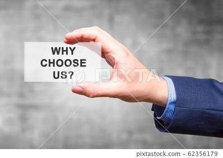 Businessman hand holding Why Choose Us? sign 62356179