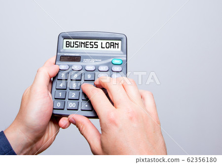 Businessman hands holding Calculator with Business Businessman hands holding Calculator with Business 62356180