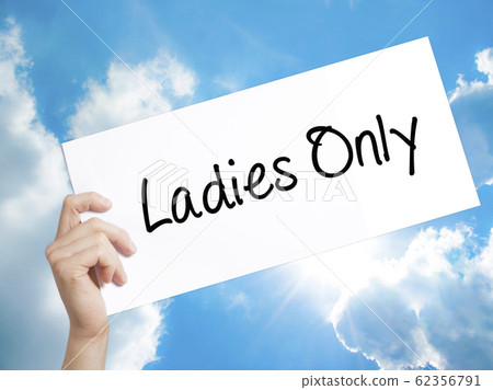 Ladies Only Sign on white paper. Man Hand Holding 62356791