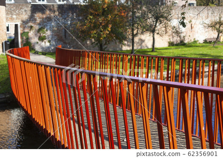 Red metal bridge to the old city wall in Vianen Red metal bridge to the old city wall in Vianen 62356901