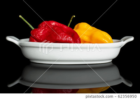 Hot chili pepper isolated on black glass Hot chili pepper isolated on black glass 62356950