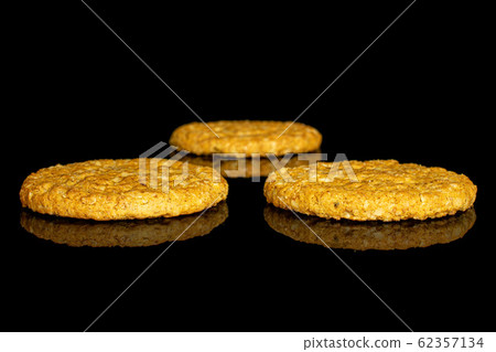 Sweet oat cookie isolated on black glass 62357134
