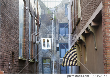 Old small vintage street with an awning Old small vintage street with an awning 62357143