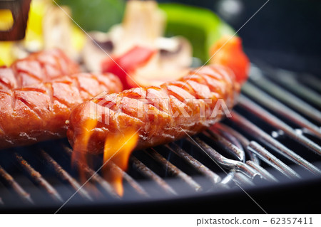 Grilling Sausages on barbecue grill Grilling Sausages on barbecue grill 62357411