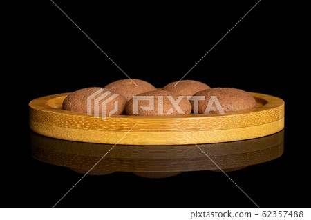 Chocolate sponge biscuit isolated on black glass Chocolate sponge biscuit isolated on black glass 62357488