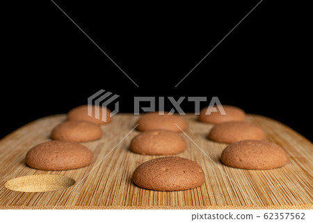 Chocolate sponge biscuit isolated on black glass 62357562