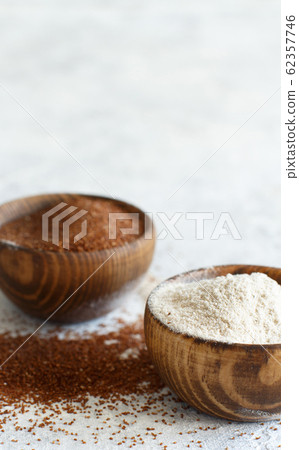 Teff flour and teff grain  in bowls 62357746