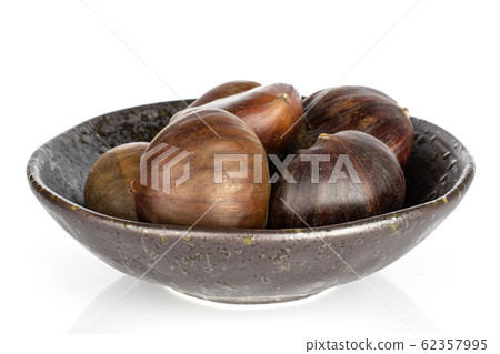 Brown edible chestnut isolated on white Brown edible chestnut isolated on white 62357995