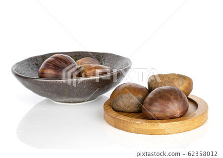 Brown edible chestnut isolated on white Brown edible chestnut isolated on white 62358012